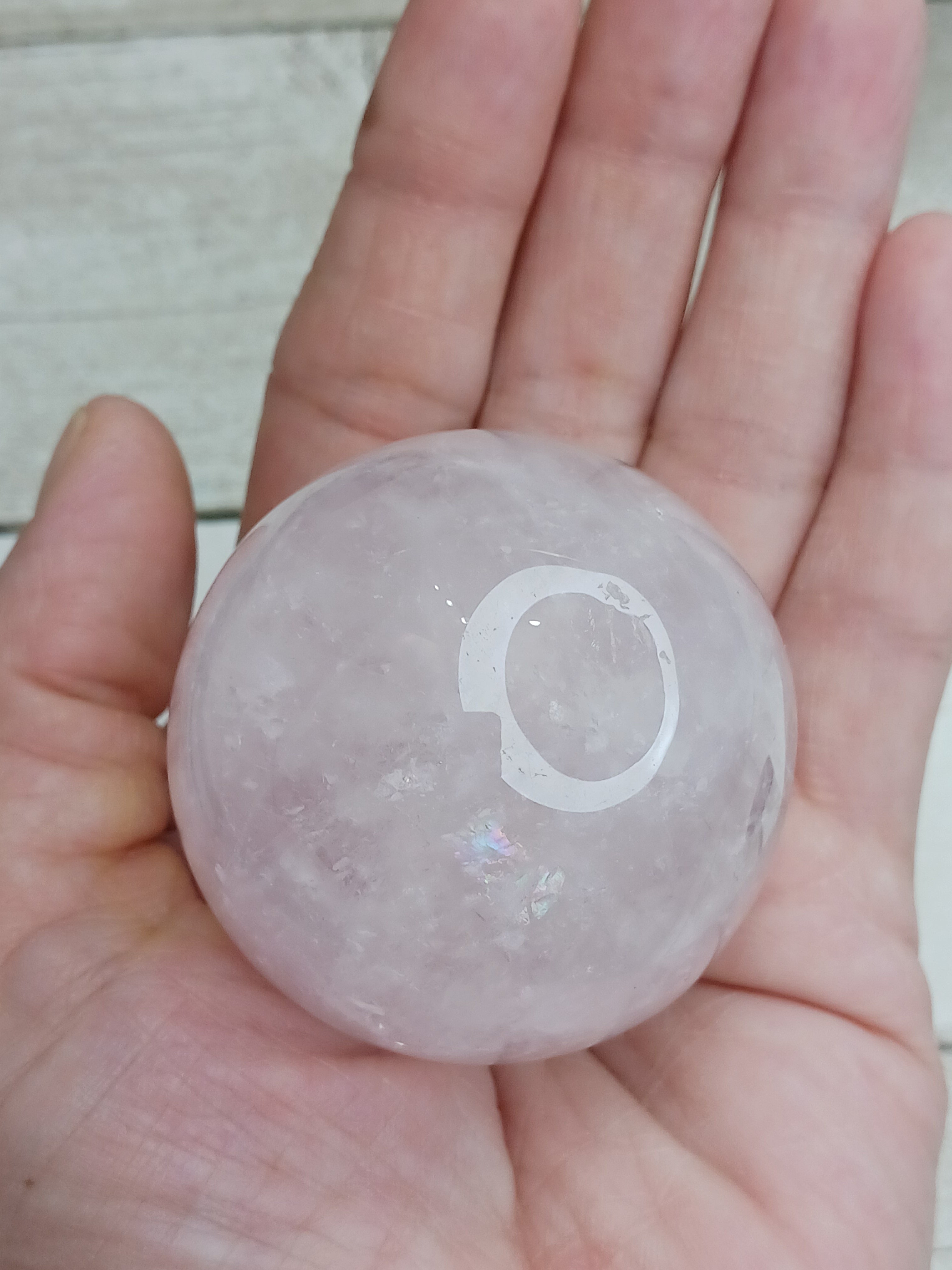 Rose quartz sphere with wooden stand