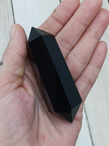 Double terminated black obsidian point